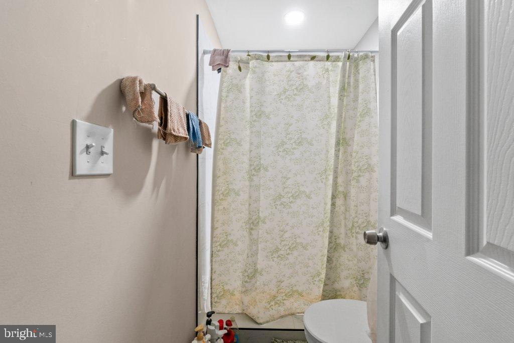 1913 Christian Street Baltimore, MD 21223 - Photo 17 of 18 Cozy bathroom with soft, inviting tones.