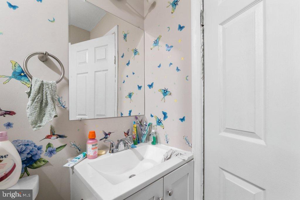 1913 Christian Street Baltimore, MD 21223 - Photo 18 of 18 Charming bathroom with whimsical butterfly decor.