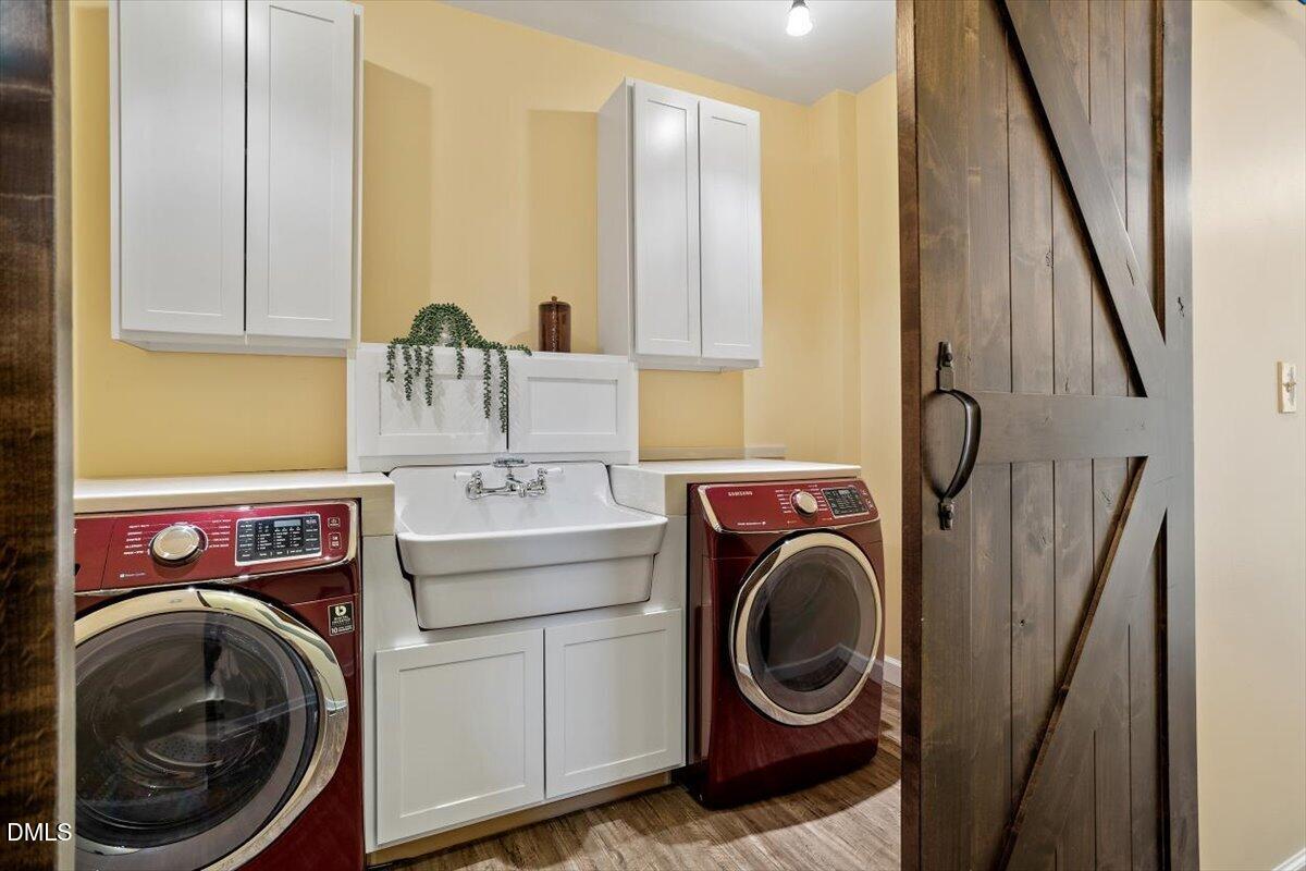 7505 Penny Road Raleigh, NC 27606 - Photo 24 of 35 a utility room with dryer and washer