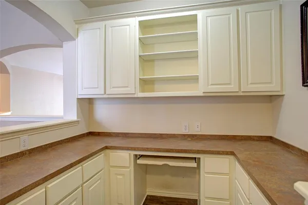 a kitchen with a sink and cabinets