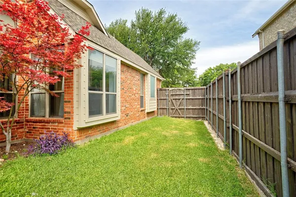 a view of backyard with green space