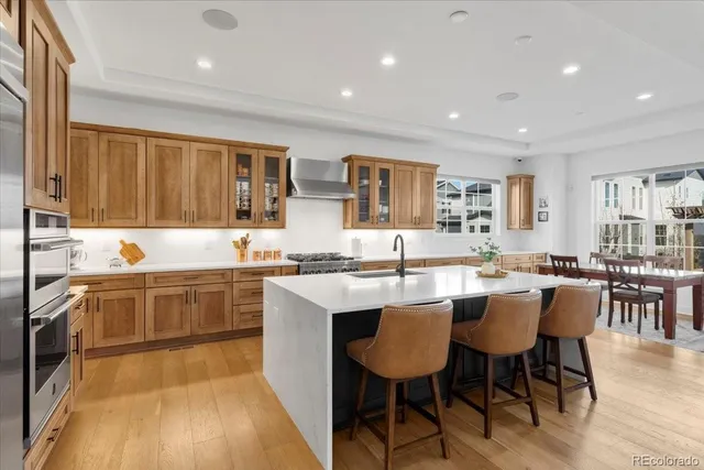 a kitchen with lots of counter top space and dining table