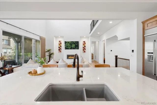 a kitchen with a sink and a large window