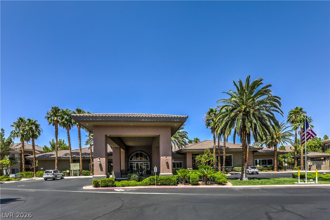 9050 West Warm Springs Road, Unit 2033 Las Vegas, NV 89148 - Photo 25 of 30 A grand entrance with mature palm trees welcomes you to this resort-style community.