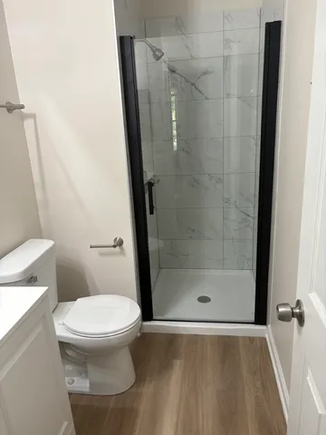 a bathroom with a sink toilet and mirror