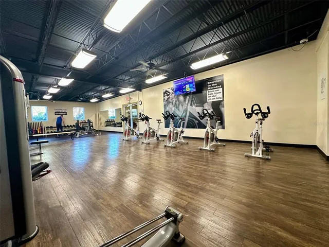 a view of a studio with wooden floor
