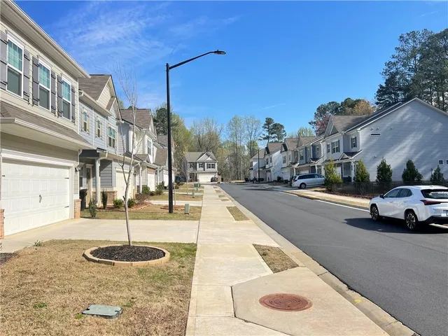 a view of a city street with a building
