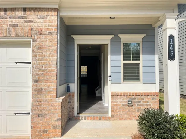 a front view of a house with a lots of windows