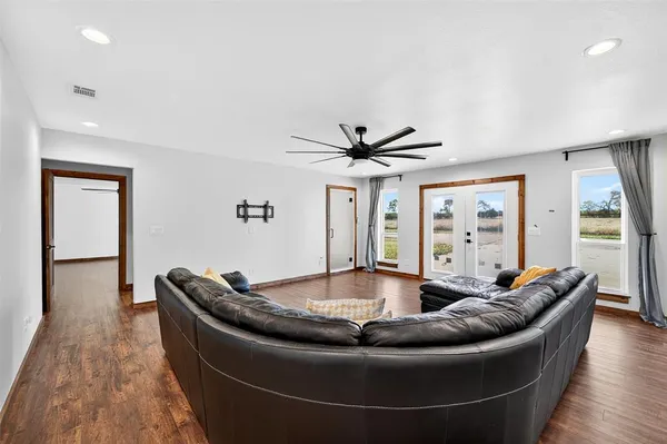 a living room with furniture and a large window