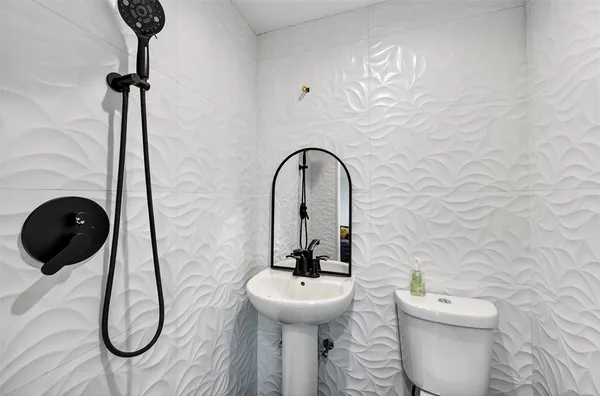 a bathroom with a toilet and a sink