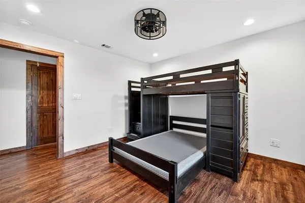 a view of room with wooden floor