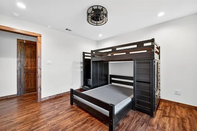 a view of room with wooden floor