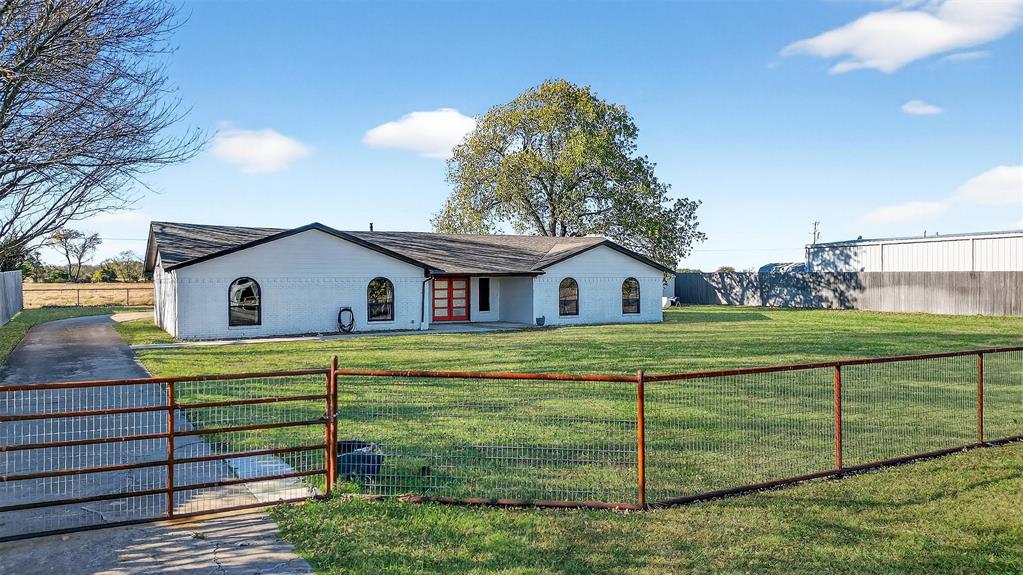 616 East Bells Boulevard Bells, TX 75414 - Photo 32 of 39 a front view of a house with a yard