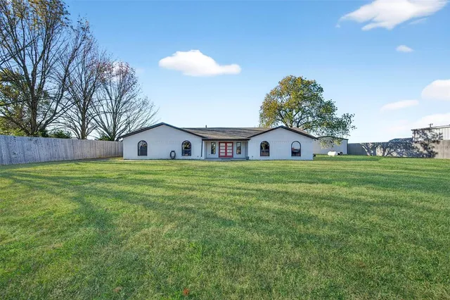 a house view with a garden space