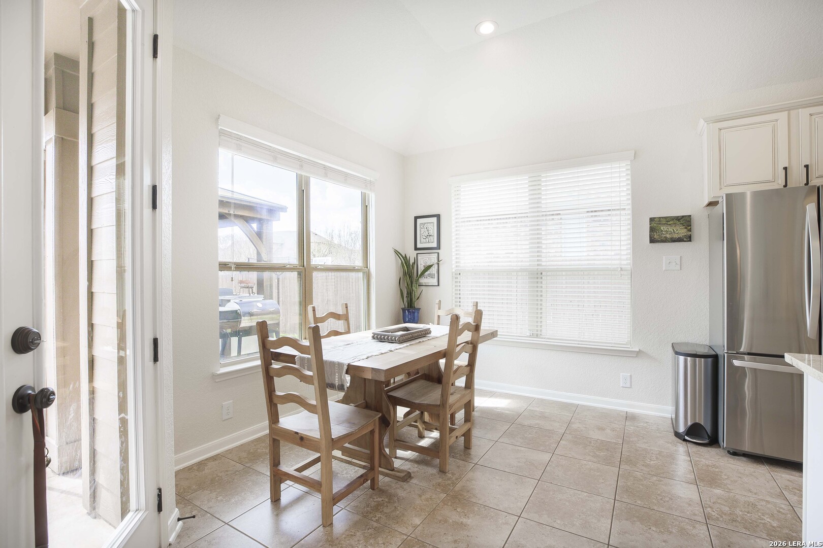 3806 Brahman Road Bulverde, TX 78163 - Photo 16 of 36 a dining room with furniture and a window