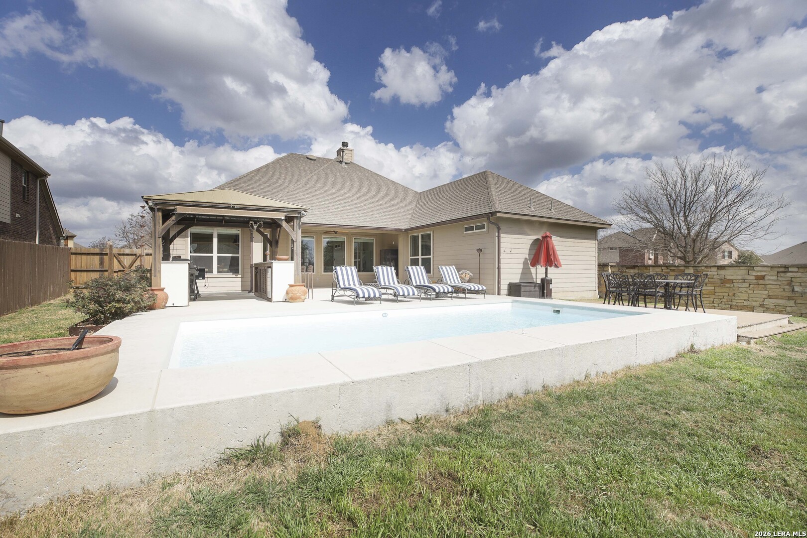 3806 Brahman Road Bulverde, TX 78163 - Photo 29 of 36 a front view of a house with a yard