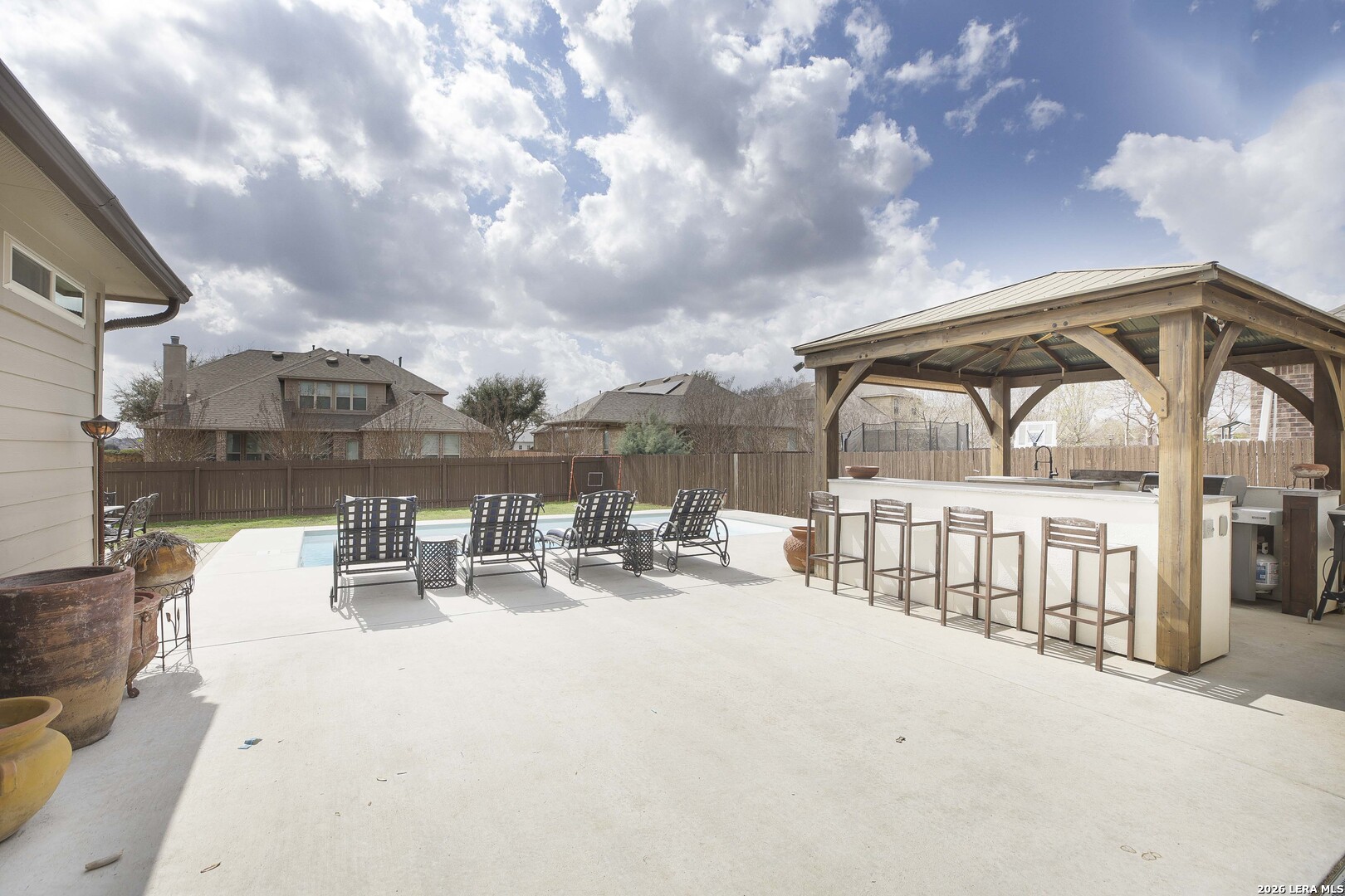 3806 Brahman Road Bulverde, TX 78163 - Photo 30 of 36 a view of swimming pool with outdoor seating and city view