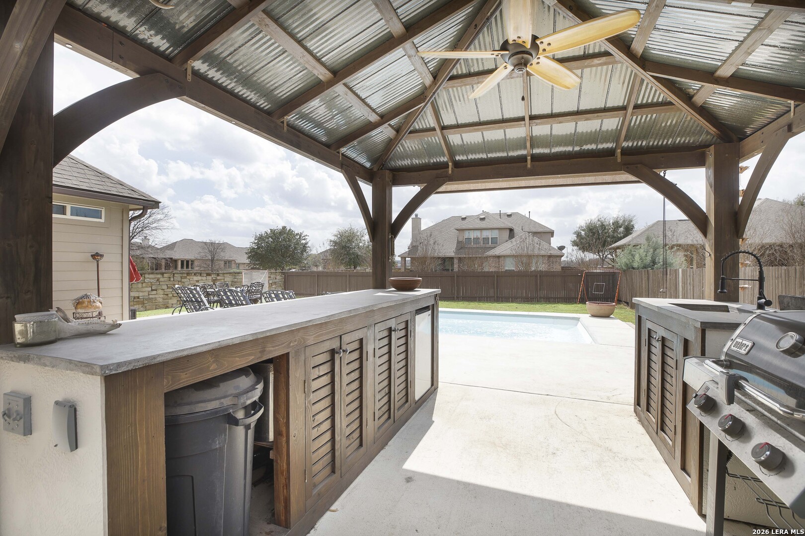 3806 Brahman Road Bulverde, TX 78163 - Photo 31 of 36 a view of a patio with a table and chairs