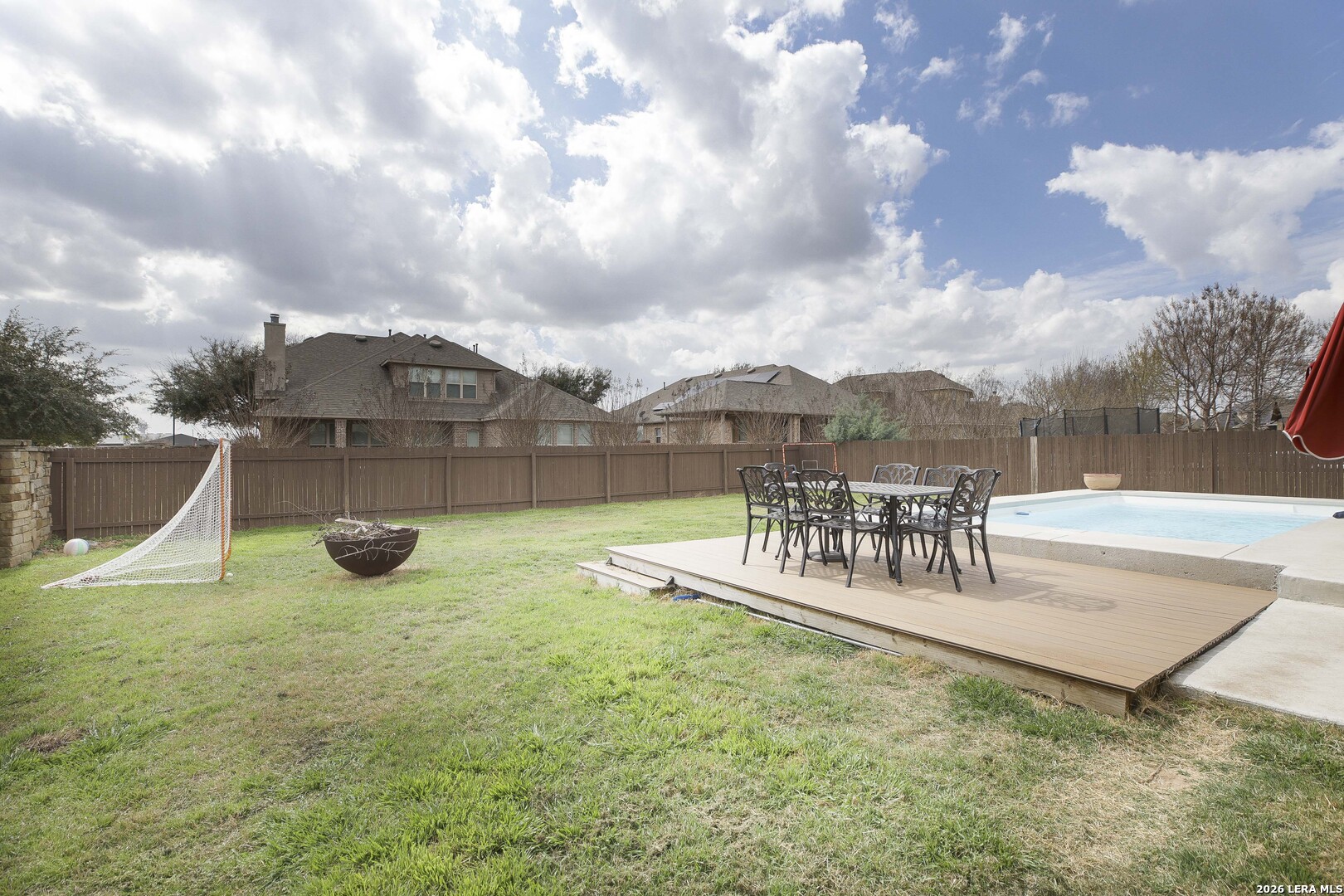 3806 Brahman Road Bulverde, TX 78163 - Photo 35 of 36 a view of a swimming pool with a garden