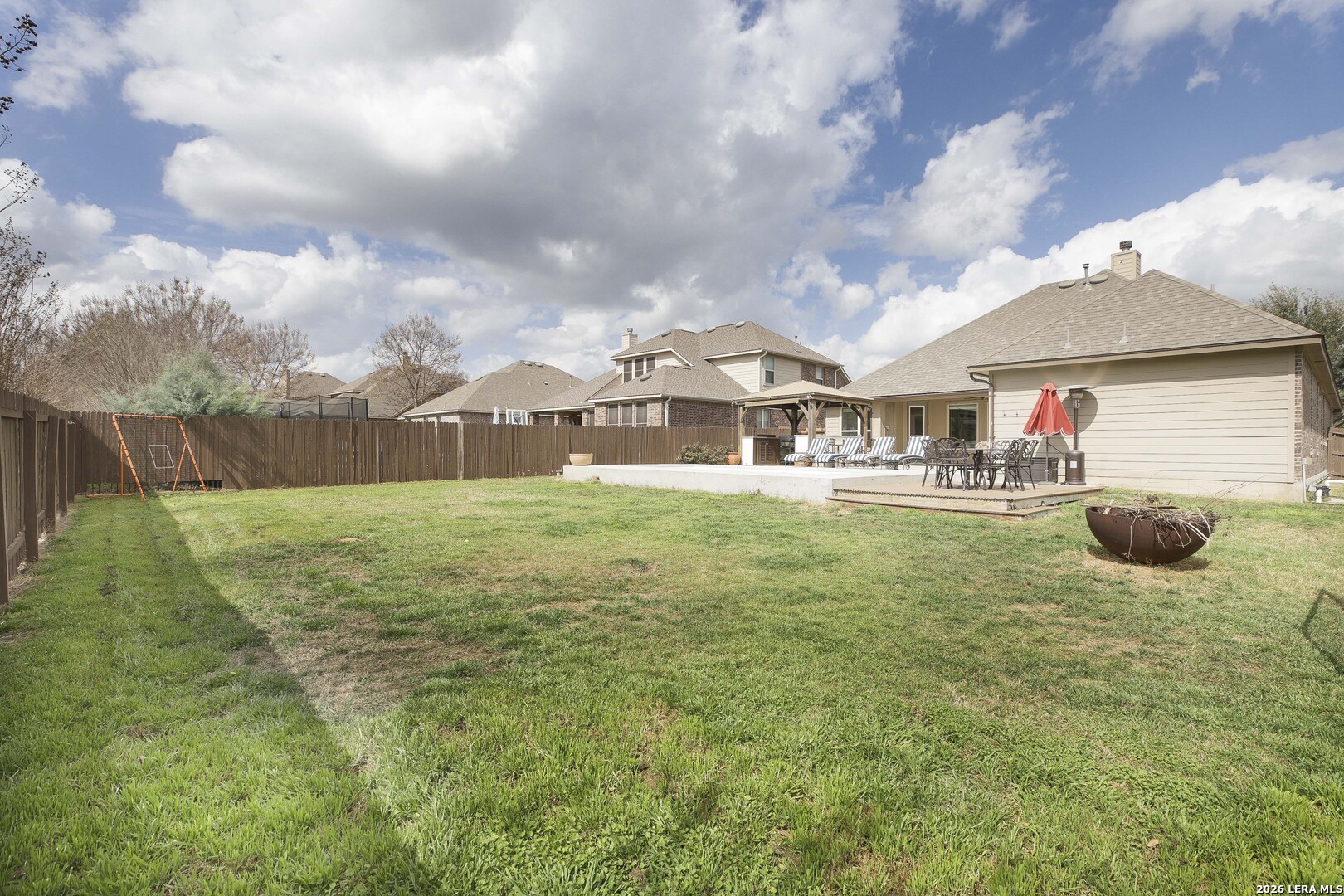 3806 Brahman Road Bulverde, TX 78163 - Photo 36 of 36 a view of a house with a big yard and sitting area