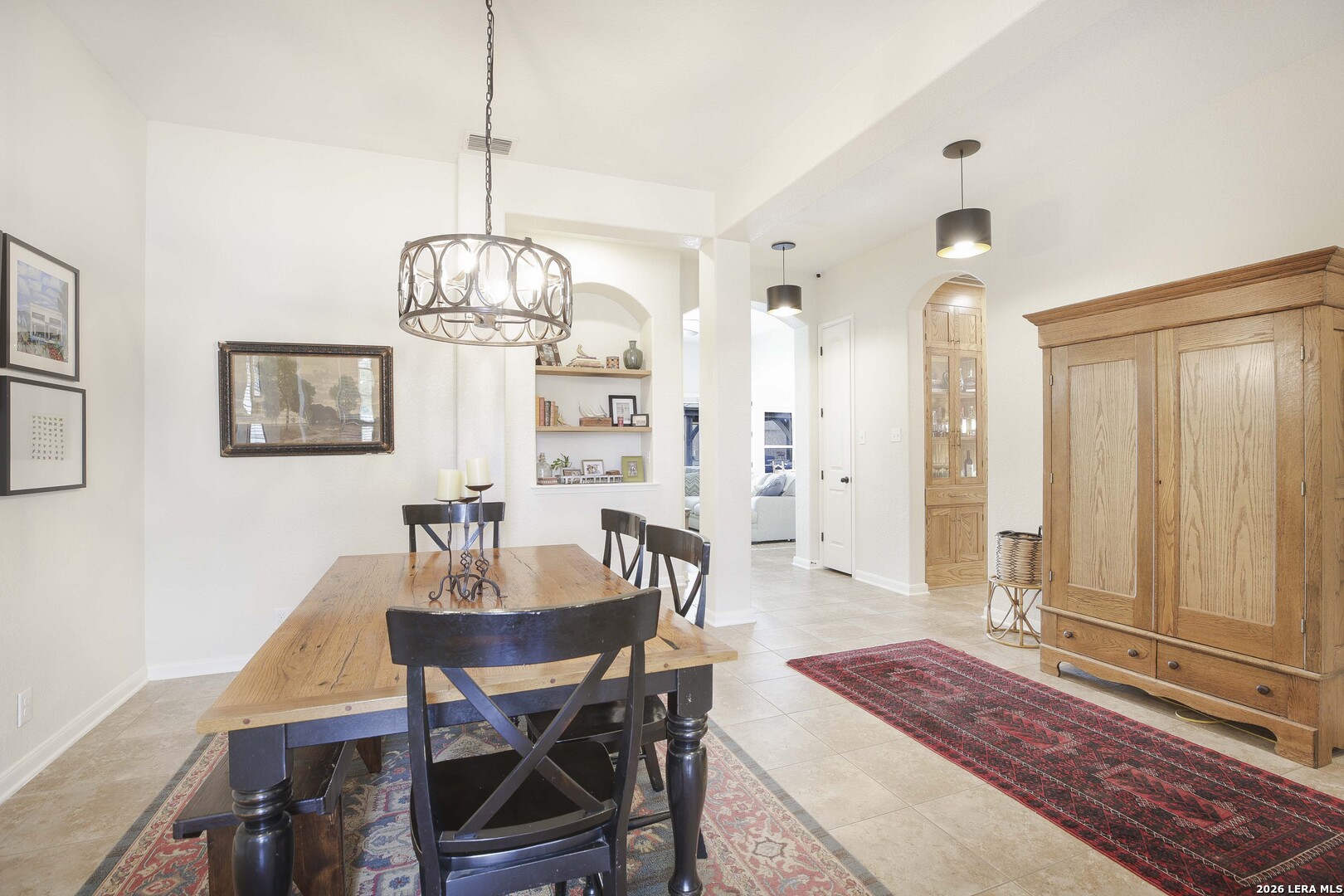3806 Brahman Road Bulverde, TX 78163 - Photo 4 of 36 a view of a dining room with furniture window and wooden floor