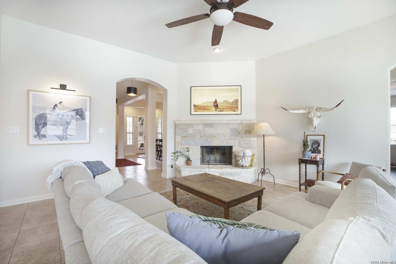 3806 Brahman Road Bulverde, TX 78163 - Photo 6 of 36 a living room with furniture and a fireplace