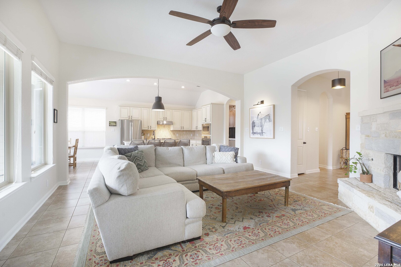 3806 Brahman Road Bulverde, TX 78163 - Photo 7 of 36 a living room with furniture and a view of kitchen