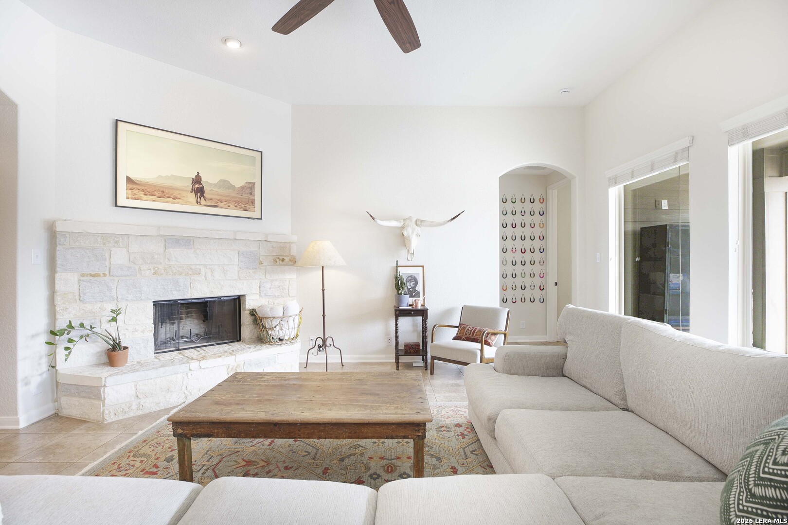 3806 Brahman Road Bulverde, TX 78163 - Photo 8 of 36 a living room with furniture and a fireplace