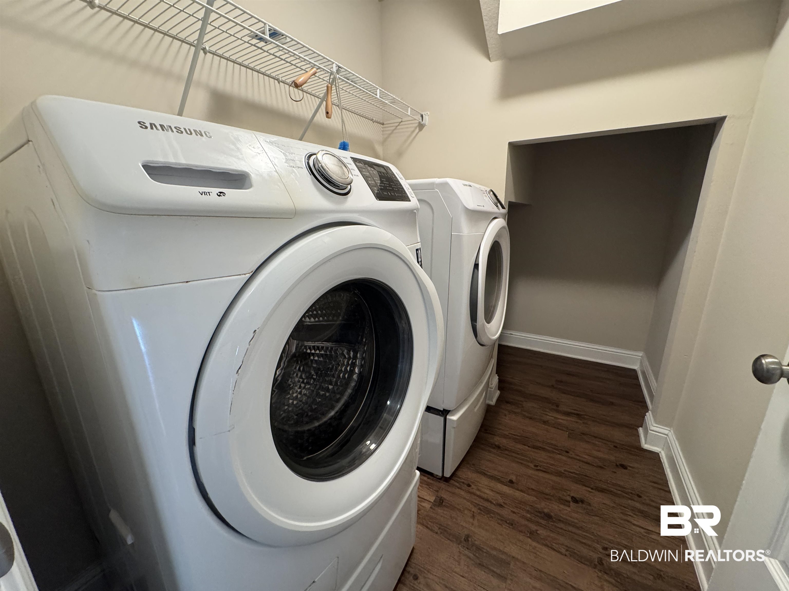 6811 Spaniel Drive, Unit C Daphne, AL 36527 - Photo 23 of 33 Laundry room featuring washing machine and dryer, dark wood-style flooring, and baseboards
