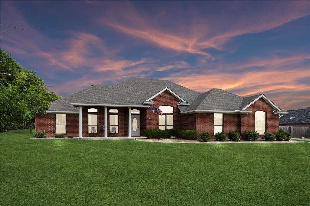 Brick facade residence with a gabled roofline
