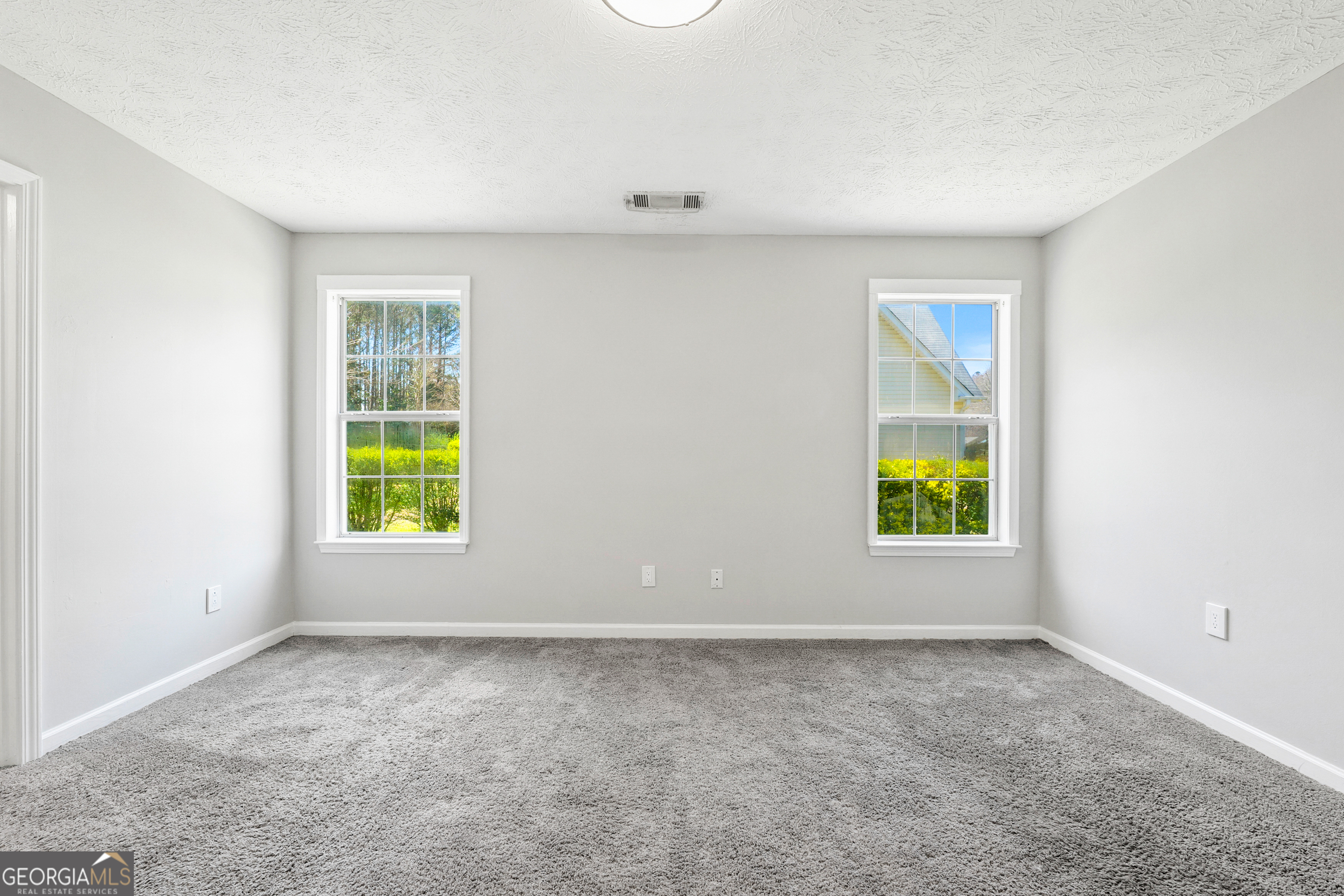 108 Nicki Court Hampton, GA 30228 - Photo 14 of 27 an empty room with a window