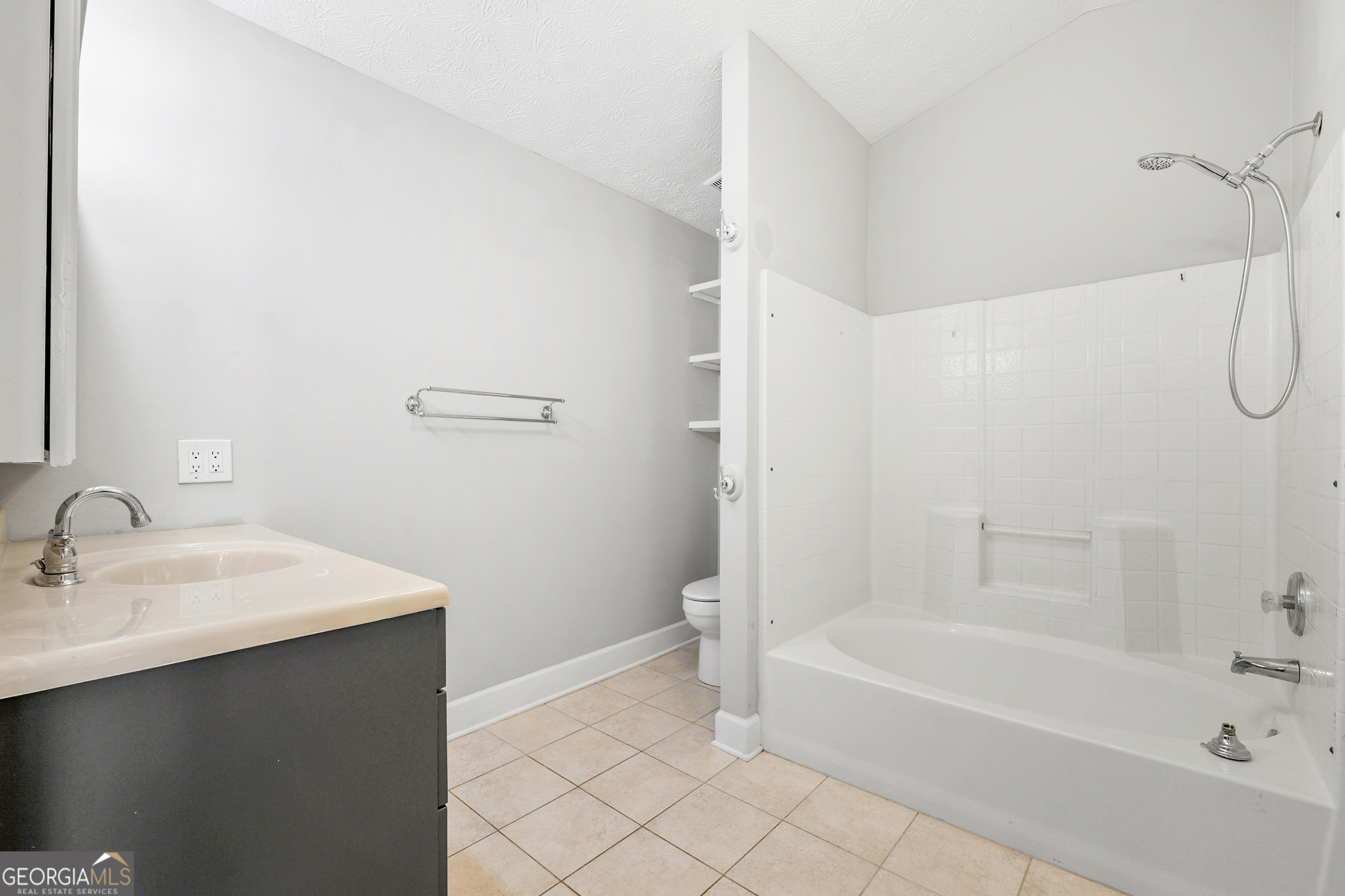 108 Nicki Court Hampton, GA 30228 - Photo 15 of 27 a bathroom with a sink and a bathtub