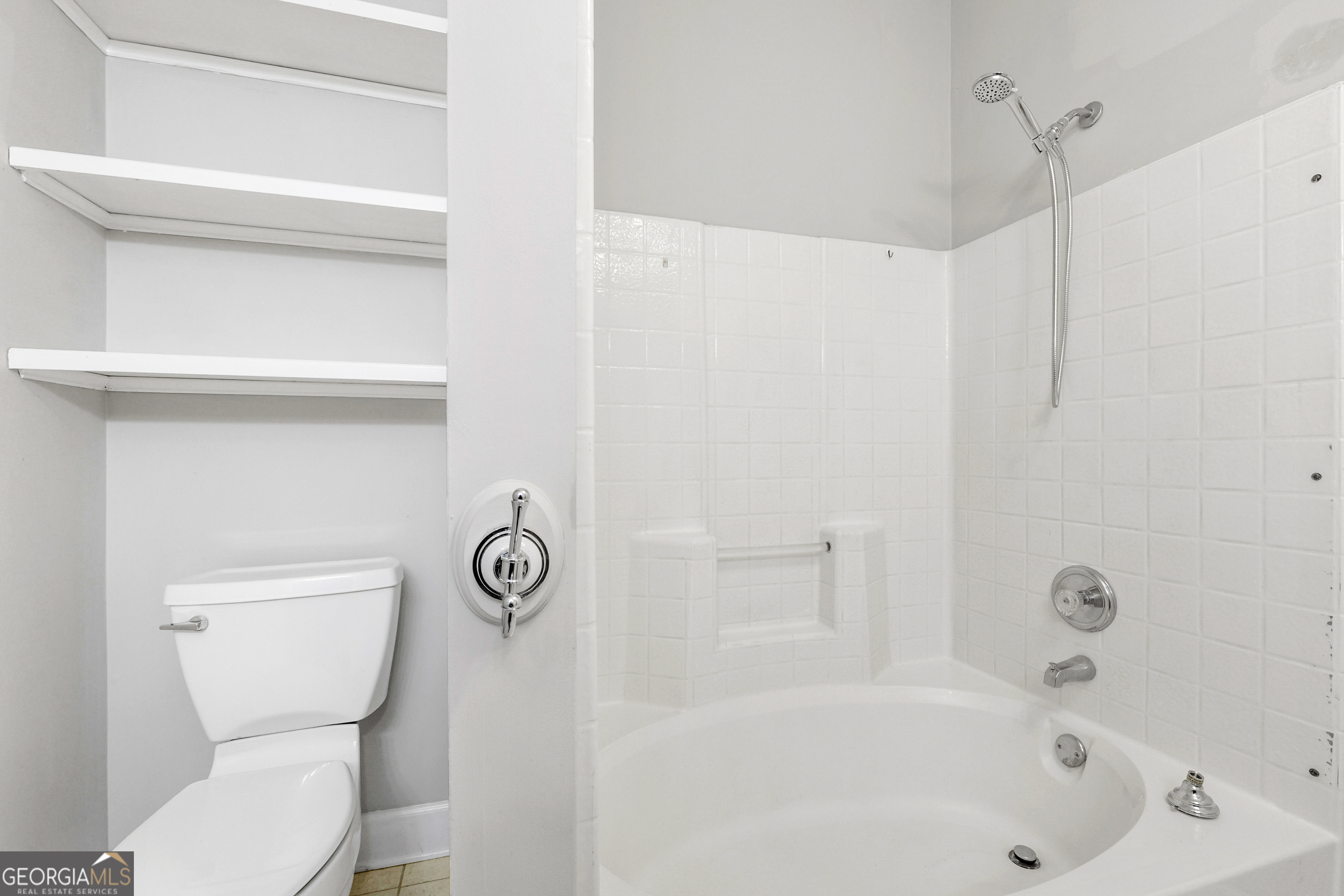 108 Nicki Court Hampton, GA 30228 - Photo 16 of 27 a bathroom with a toilet and a bathtub