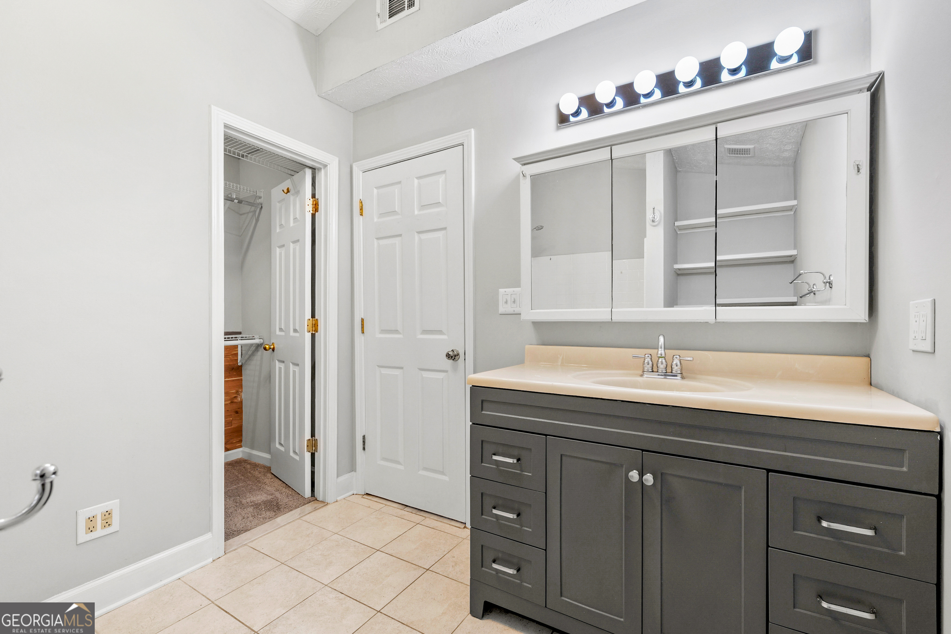 108 Nicki Court Hampton, GA 30228 - Photo 17 of 27 a bathroom with a sink and a mirror