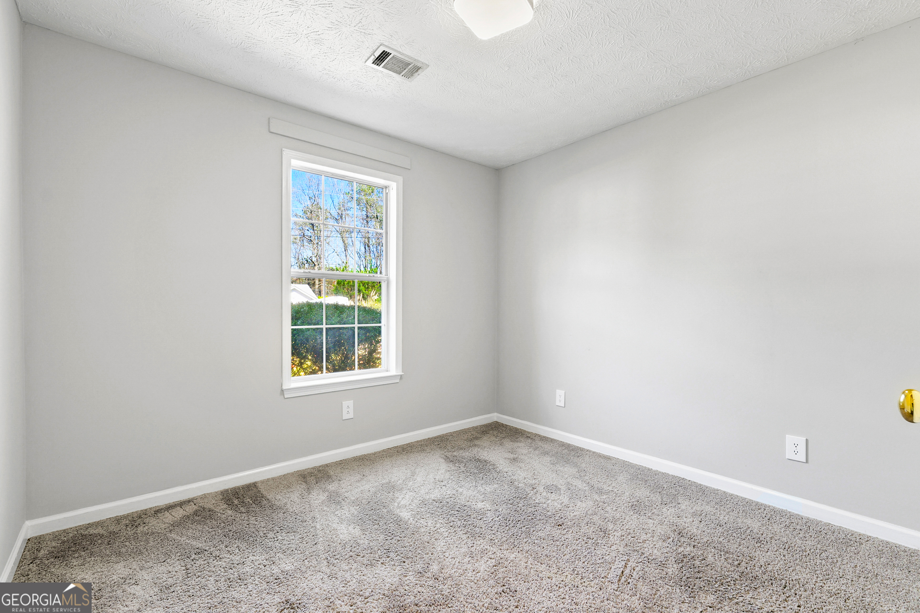 108 Nicki Court Hampton, GA 30228 - Photo 21 of 27 an empty room with a window