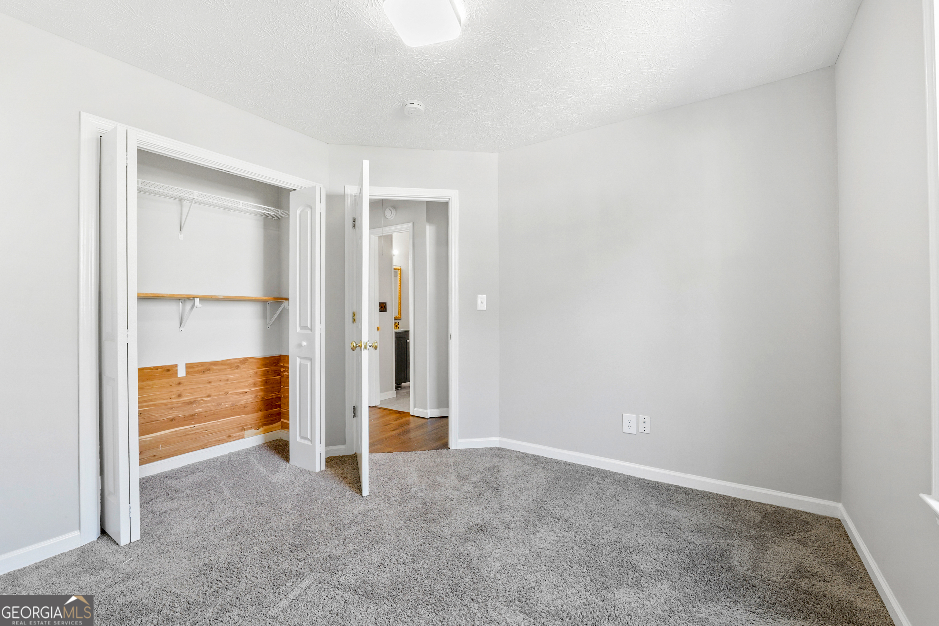 108 Nicki Court Hampton, GA 30228 - Photo 22 of 27 a view of an empty room and window