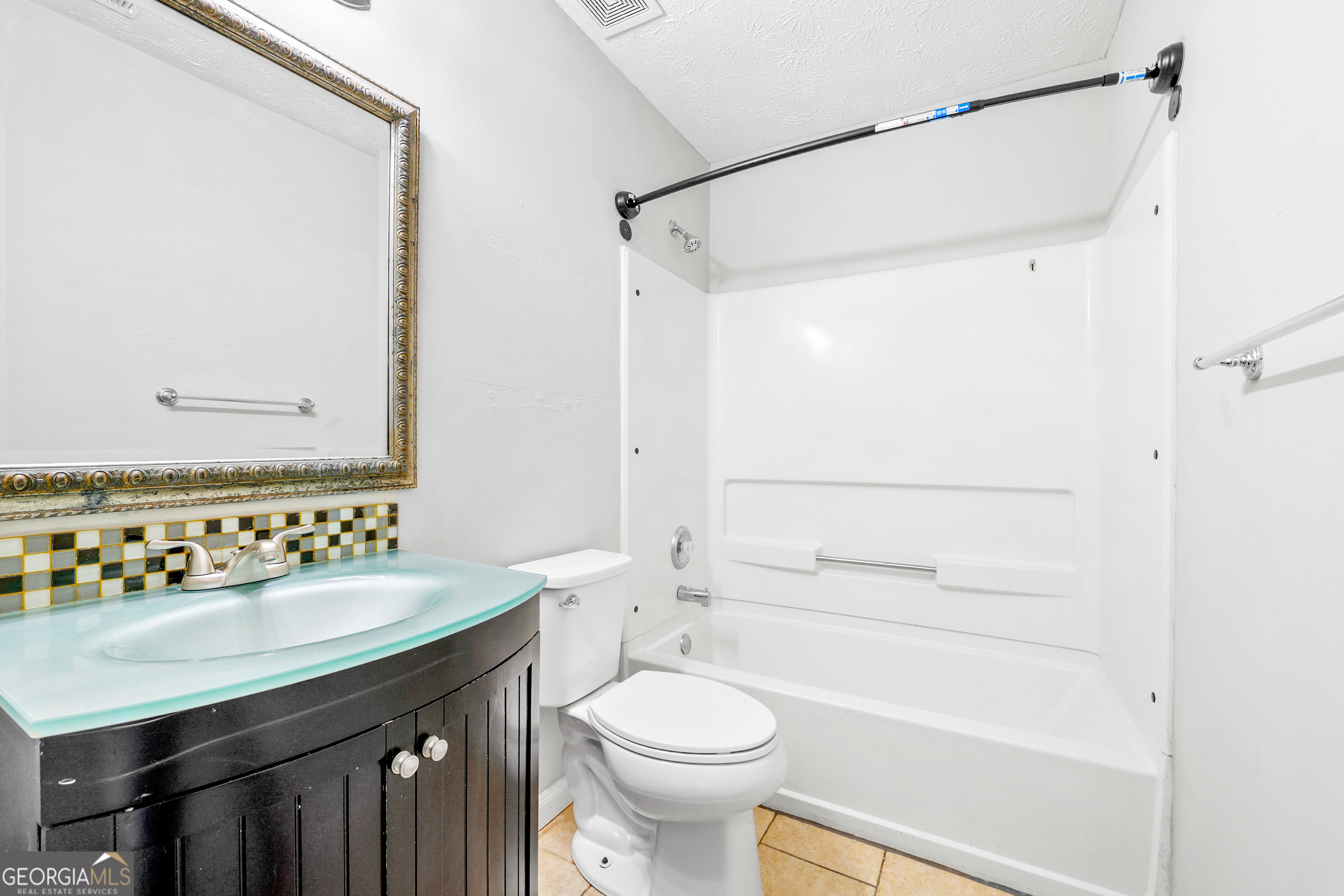 108 Nicki Court Hampton, GA 30228 - Photo 23 of 27 a bathroom with a sink a toilet and shower