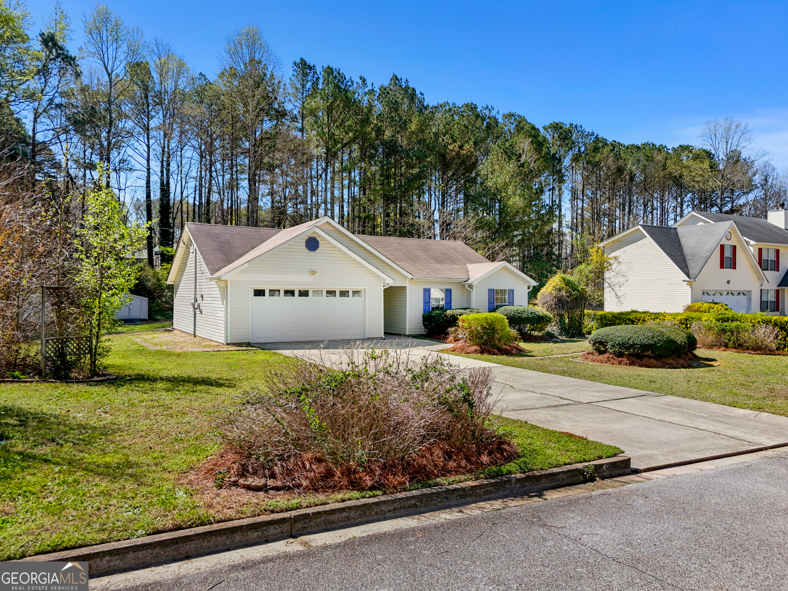 108 Nicki Court Hampton, GA 30228 - Photo 25 of 27 a front view of a house with a yard and garage