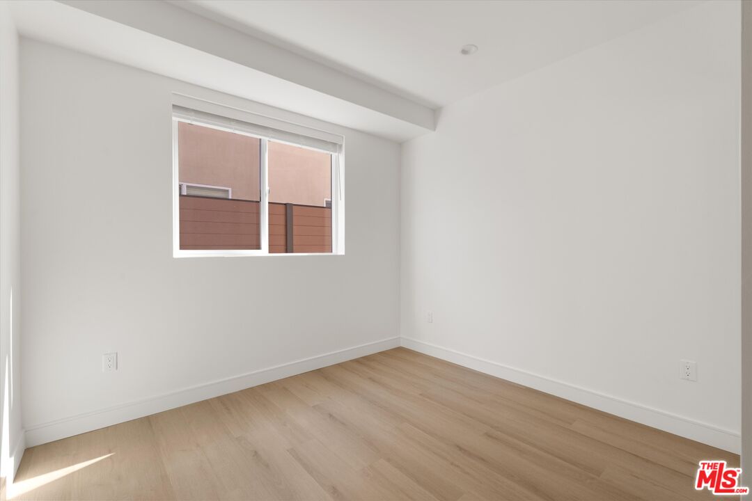 15211 1/2 Morrison Street Sherman Oaks, CA 91403 - Photo 12 of 16 an empty room with a window