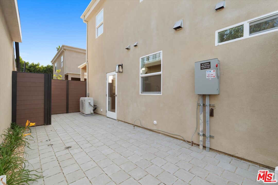 15211 1/2 Morrison Street Sherman Oaks, CA 91403 - Photo 14 of 16 a view of a hallway with paintings on the wall
