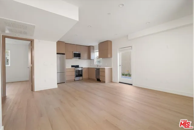 a view of a kitchen with a sink cabinets and a living room