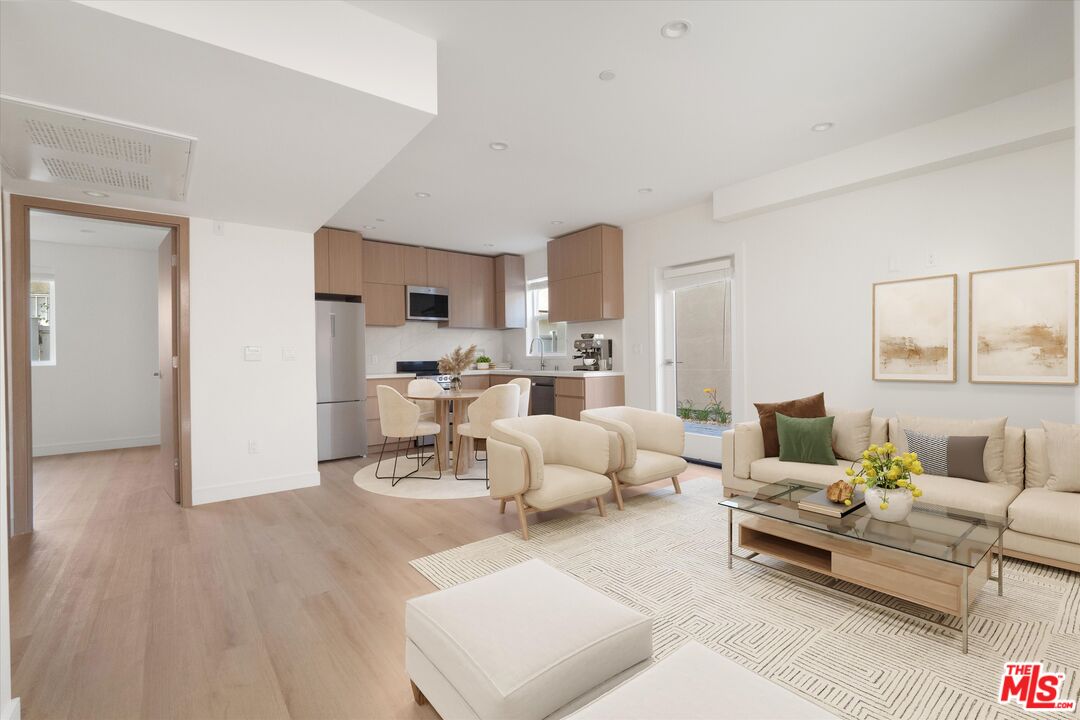 15211 1/2 Morrison Street Sherman Oaks, CA 91403 - Photo 3 of 16 a living room with furniture and a wooden floor
