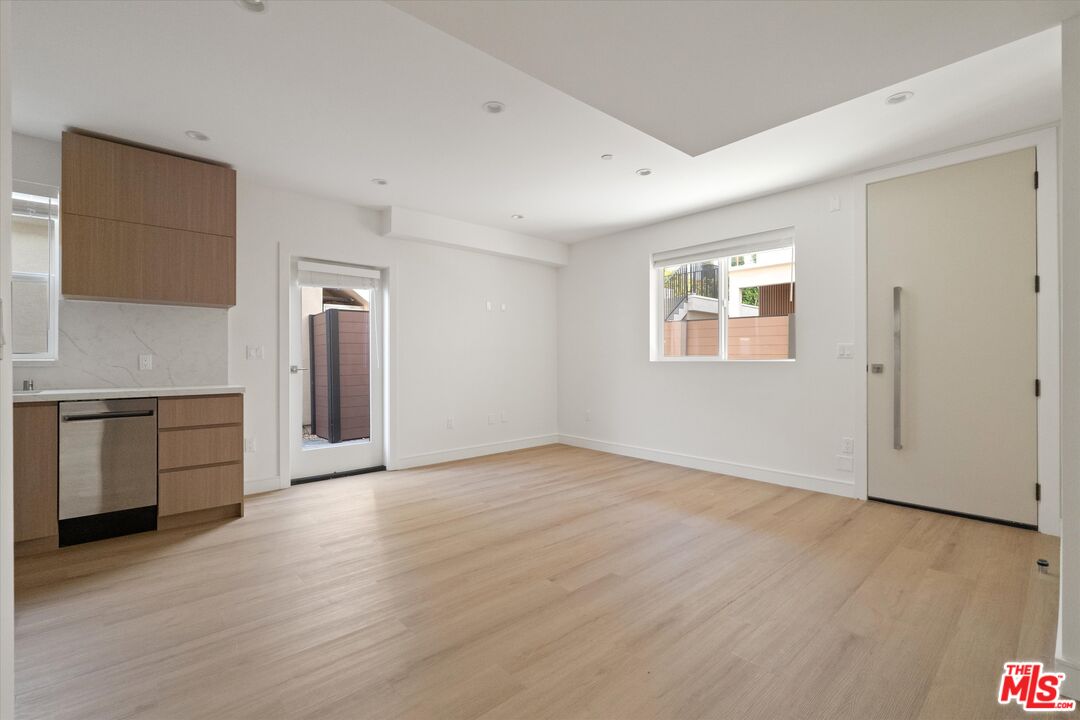 15211 1/2 Morrison Street Sherman Oaks, CA 91403 - Photo 4 of 16 a view of a kitchen with a sink and a stove top oven