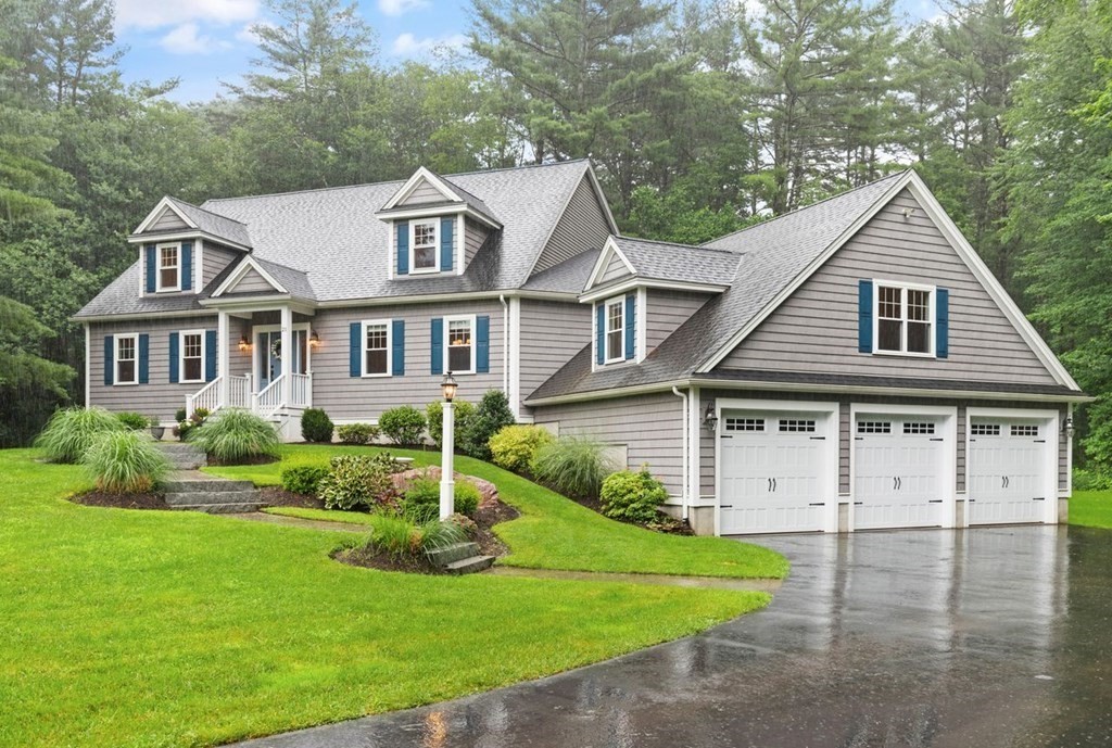 21 Elm Street Canton, MA 02021 - Photo 1 of 39 a front view of a house with a yard and garage