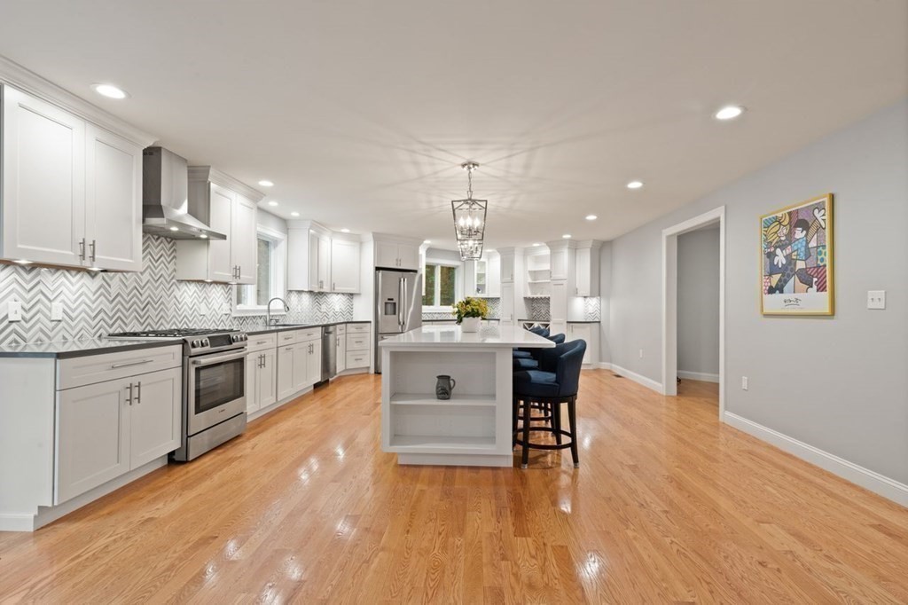 21 Elm Street Canton, MA 02021 - Photo 15 of 39 a kitchen with a sink cabinets and wooden floor