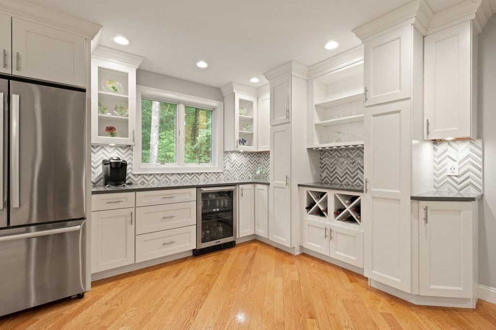 21 Elm Street Canton, MA 02021 - Photo 17 of 39 a kitchen with stainless steel appliances granite countertop a refrigerator sink and cabinets