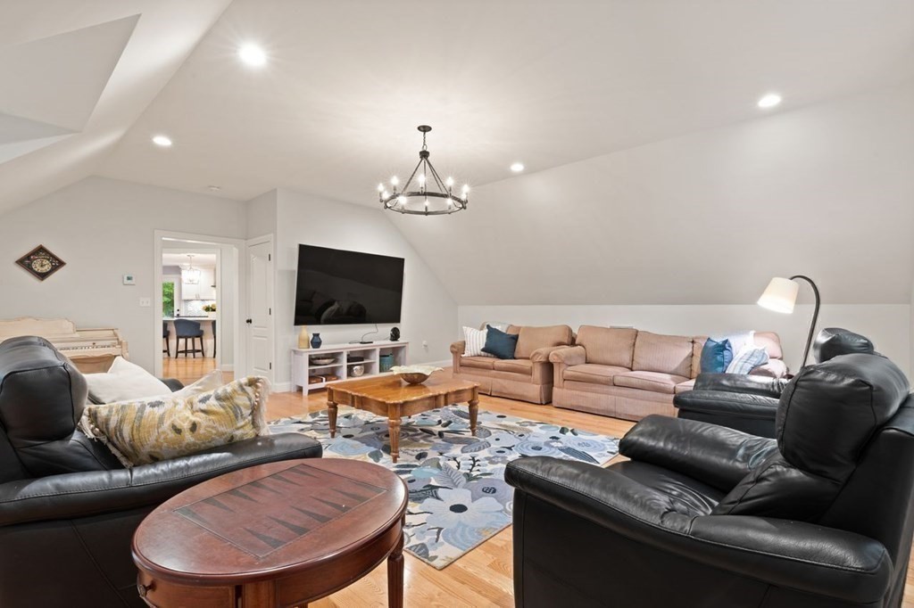 21 Elm Street Canton, MA 02021 - Photo 20 of 39 a living room with furniture and a flat screen tv