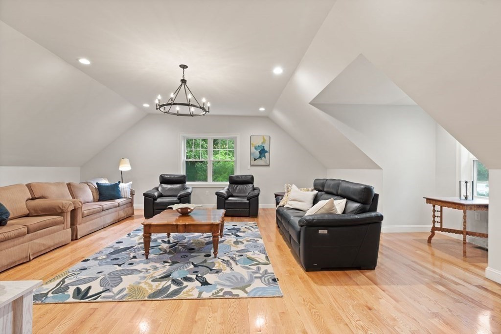 21 Elm Street Canton, MA 02021 - Photo 21 of 39 a living room with furniture rug and a chandelier