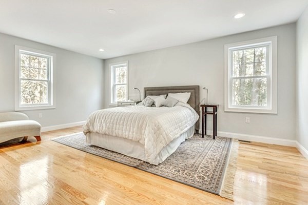 21 Elm Street Canton, MA 02021 - Photo 23 of 39 a bedroom with a bed and wooden floor