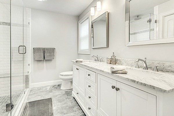 21 Elm Street Canton, MA 02021 - Photo 24 of 39 a spacious bathroom with a granite countertop sink a toilet and a mirror